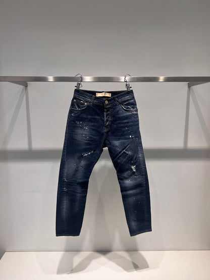 Denim slim fit con macchie bianche